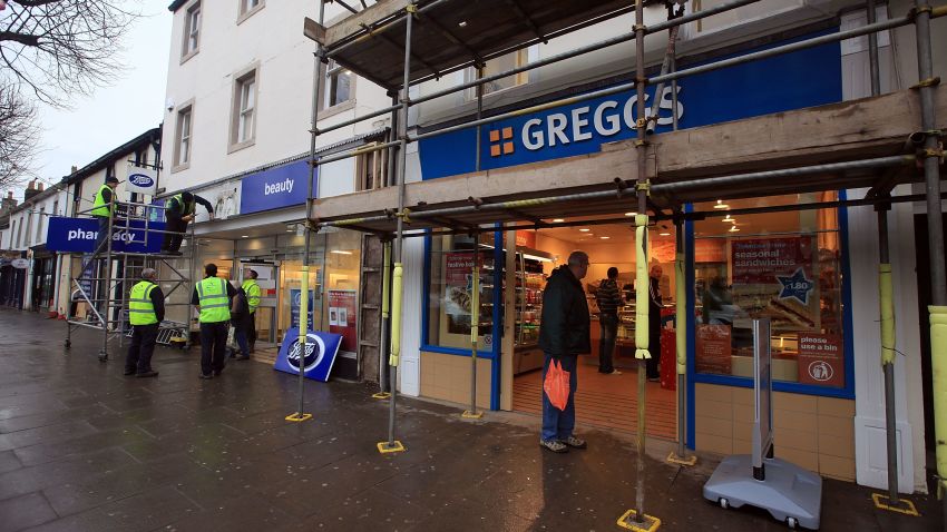 COCKERMOUTH, ENGLAND - DECEMBER 16:  Greggs, the bakers, the first flooded damaged shop to open on Cockermouth High Street helps feed the army of construction workers on December 16, 2009 in Cockermouth, England. An army of contractors and utility workers continue to work in Cumbria to rebuild the infrastructure after the unprecedented floods. In addition to recent aid the government today announced an extra 500,000 GBP to help farmers reinstate fields littered with flood debris.  (Photo by Christopher Furlong/Getty Images)