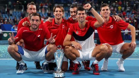 Novak Djokovic (front and center) celebrates with his Serbian teammates after the ATP Cup final.