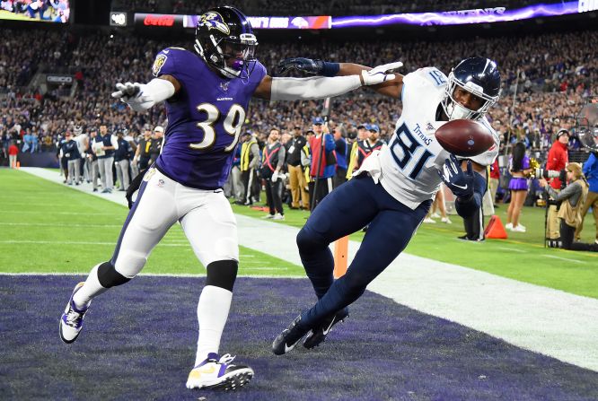Tennessee Titans tight end Jonnu Smith hauls in a touchdown catch over Ravens defender Brandon Carr during the first quarter of their AFC Divisional Round playoff game in Baltimore, Maryland, on Saturday, January 11. The Titans <a href="index.php?page=&url=https%3A%2F%2Fbleacherreport.com%2Farticles%2F2870923-derrick-henry-titans-stun-lamar-jackson-ravens-advance-to-afc-championship" target="_blank" target="_blank">won the game 28-12</a> and will advance to the AFC Championship on January 19.