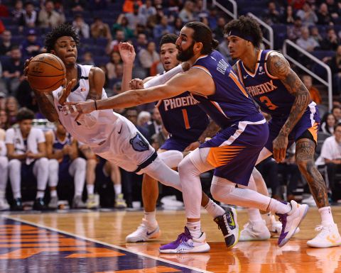 Memphis guard Ja Morant attempts to save a ball from going out of bounds during an NBA game against the Phoenix suns in Phoenix, Arizona, on Sunday, January 5.