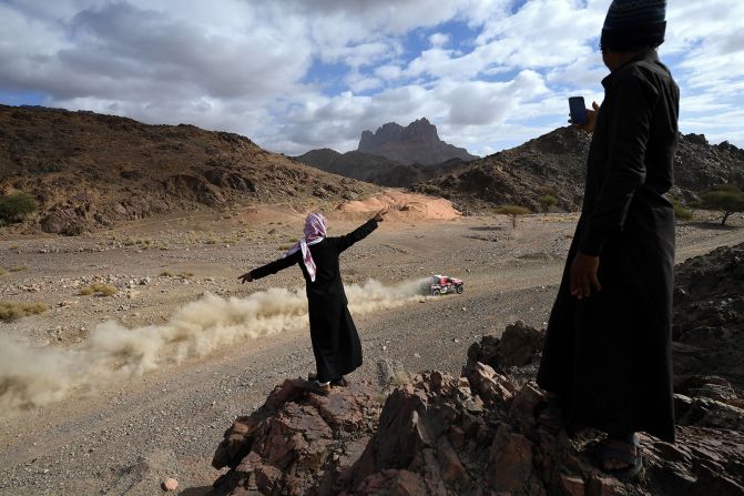 People gesture as Ford's Czech driver Martin Prokop and co-driver Viktor Chytka compete in Stage 4 of the 2020 Dakar Rally in Saudi Arabia, on Wednesday, January 8. 