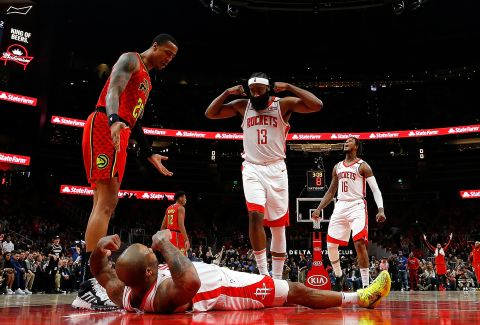 Houston Rockets' PJ Tucker reacts with James Harden after forcing a turnover against the Atlanta Hawks on Wednesday, January 8, in Atlanta. The Rockets beat the Hawks 122-115.