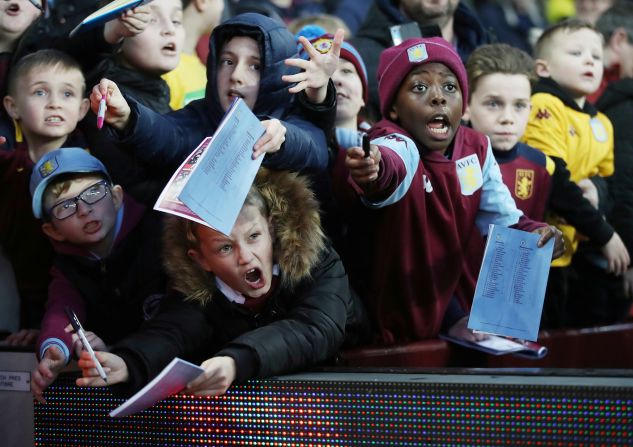 Young Aston Villa fans beg for a signatures from the athletes during a game against Manchester City on January 12, in Birmingham, England.