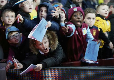 Young Aston Villa fans beg for a signatures from the athletes during a game against Manchester City on January 12, in Birmingham, England. 