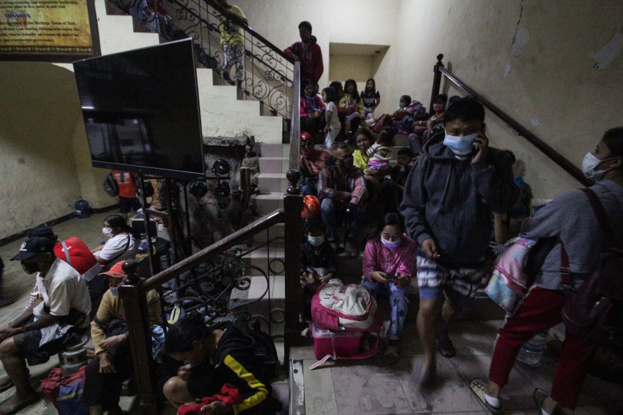 Villagers rest on stairs in Batangas.