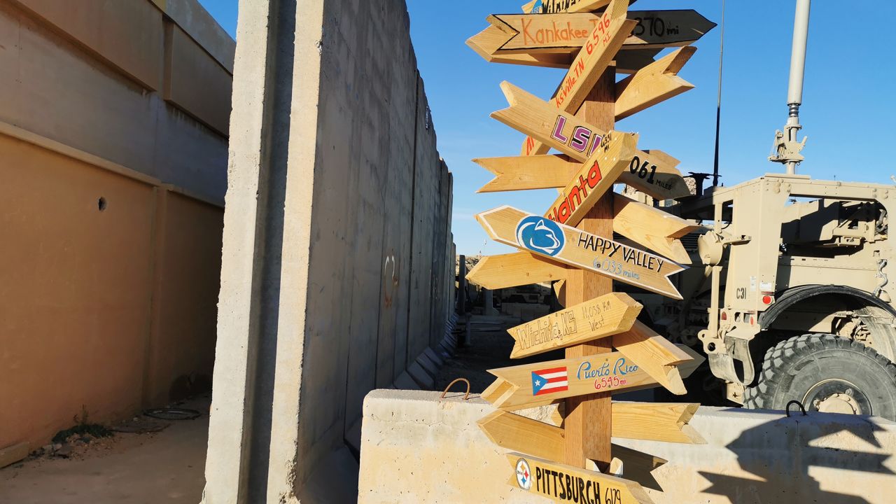 US city road signs outside a housing unit, left intact after the attack.