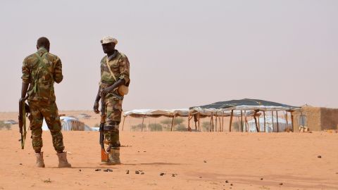 Niger soldiers stand guard at the Tazalit United Nations refugee camp in the Tahoua region