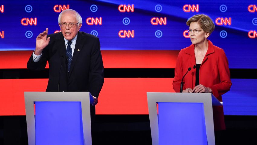 In this July 2019 photo, democratic presidential hopefuls US senator from Vermont Bernie Sanders and US Senator from Massachusetts Elizabeth Warren participate the first round of the second Democratic primary debate of the 2020 presidential campaign season in Detroit, Michigan.