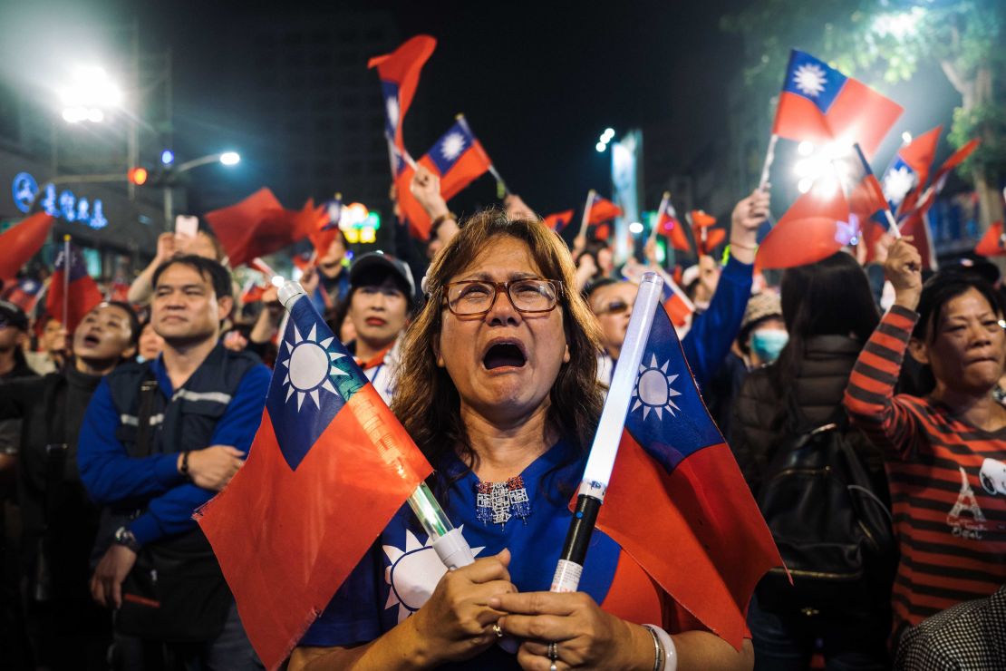 Supporters of Han Kuo-Yu, presidential candidate for Taiwan's main opposition Kuomintang (KMT) party, react during a rally outside the campaign headquarters on January 11, 2020 in Kaohsiung, Taiwan.