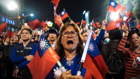 Supporters of Han Kuo-Yu, presidential candidate for Taiwan's main opposition Kuomintang (KMT) party, react during a rally outside the campaign headquarters on January 11, 2020 in Kaohsiung, Taiwan.