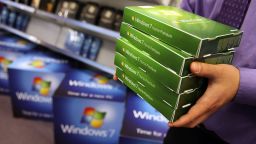 A computer store employee stacks copies of Microsoft's 'Windows 7' operating system ahead of its official launch, October 21, 2009 in London, England.