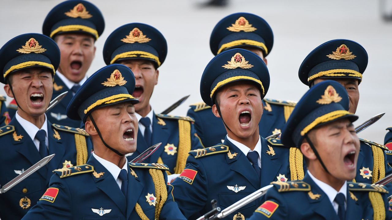 Members of a military honour guard parade during a welcome ceremony for Pakistani Prime Minister Imran Khan  outside the Great Hall of the People in Beijing on October 8, 2019. (Photo by GREG BAKER / AFP) (Photo by GREG BAKER/AFP via Getty Images)