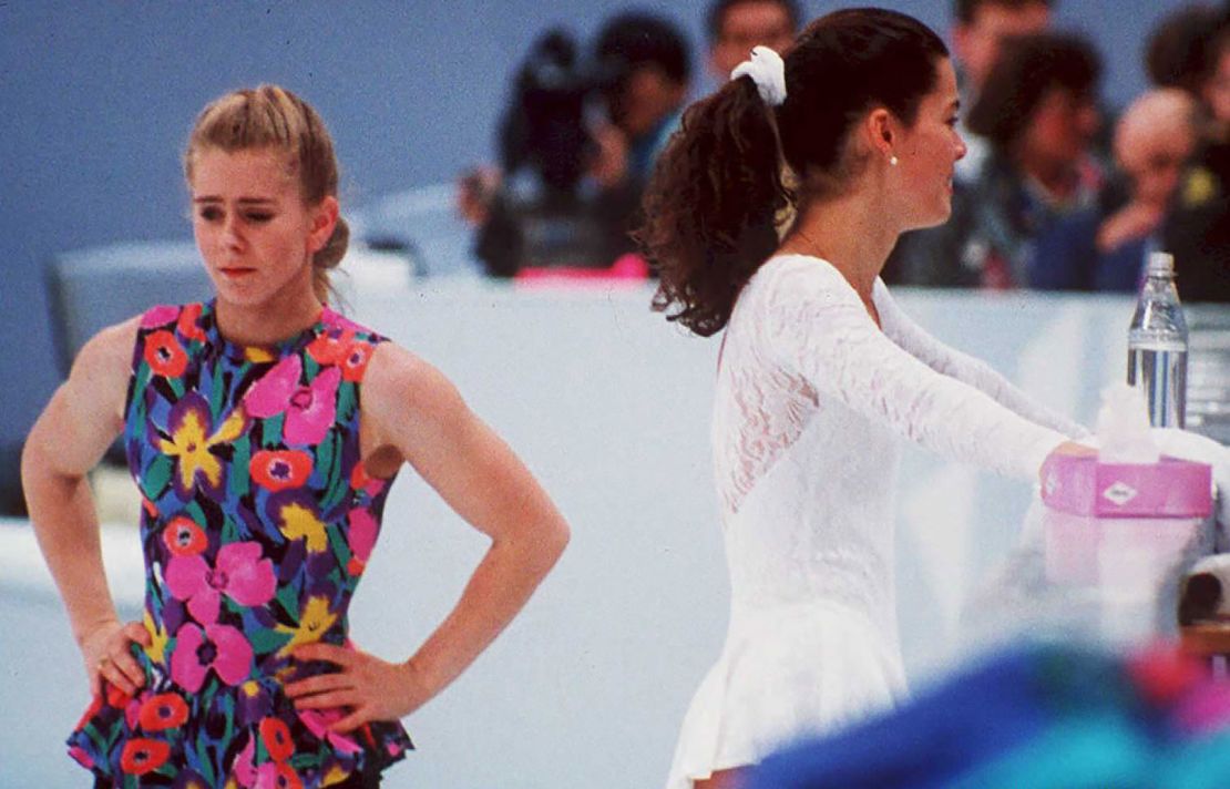 US figure skaters Tonya Harding, left, and Nancy Kerrigan avoid each other during a training session on February 17, 1994, during the Lillehammer Winter Olympics.