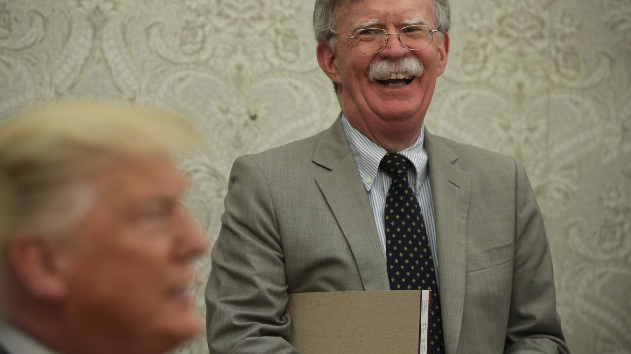 WASHINGTON, DC - AUGUST 20:  U.S. President Donald Trump speaks to members of the media as National Security Adviser John Bolton listens during a meeting with President of Romania Klaus Iohannis in the Oval Office of the White House August 20, 2019 in Washington, DC. This is Iohannis' second visit to the Trump White House and the two leaders are expected to discuss bilateral issues during their meeting.  (Photo by Alex Wong/Getty Images)