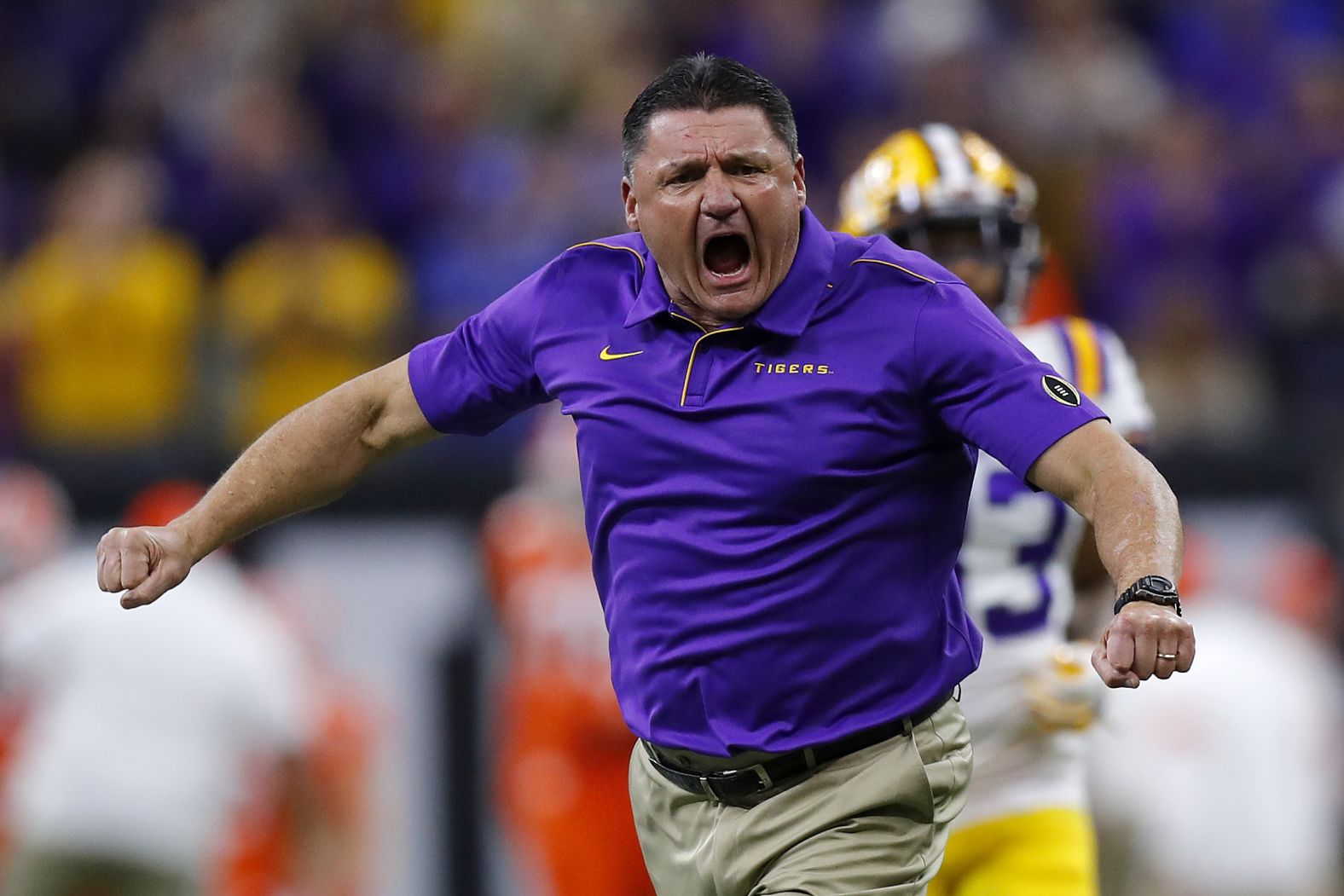 Orgeron gets fired up during pregame warm-ups.