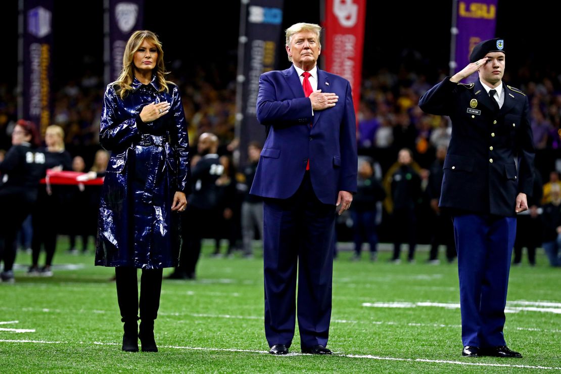 President Trump and first lady Melania Trump on the field before the game.