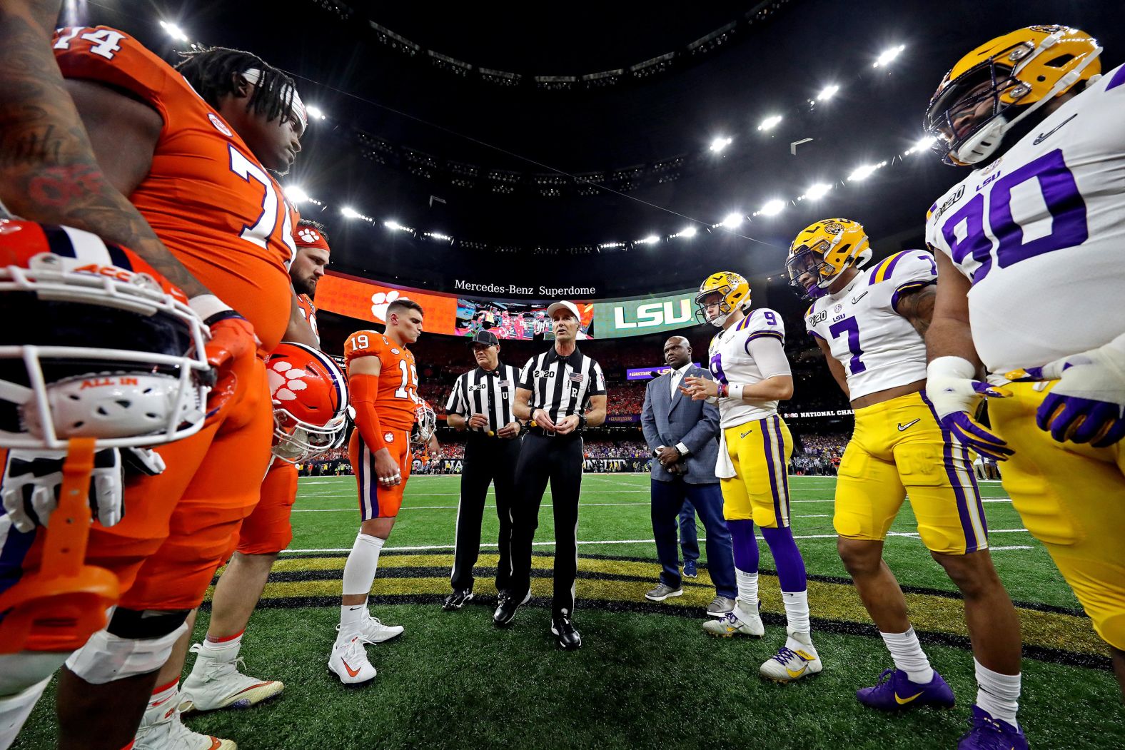 Players take part in the pregame coin toss.