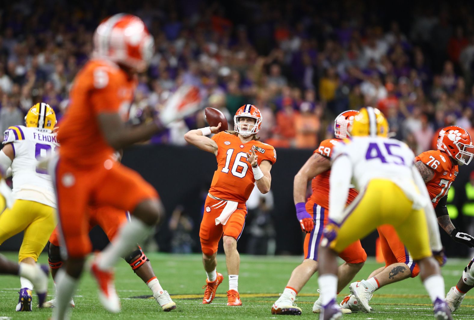Lawrence throws a pass in the first quarter.