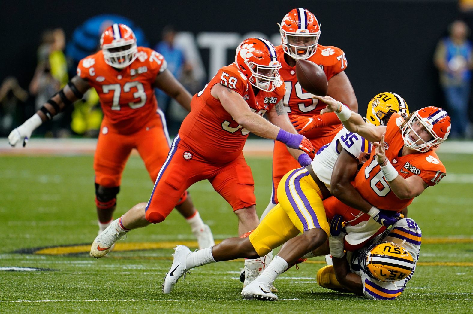 Lawrence shovels a pass under pressure in the first half.