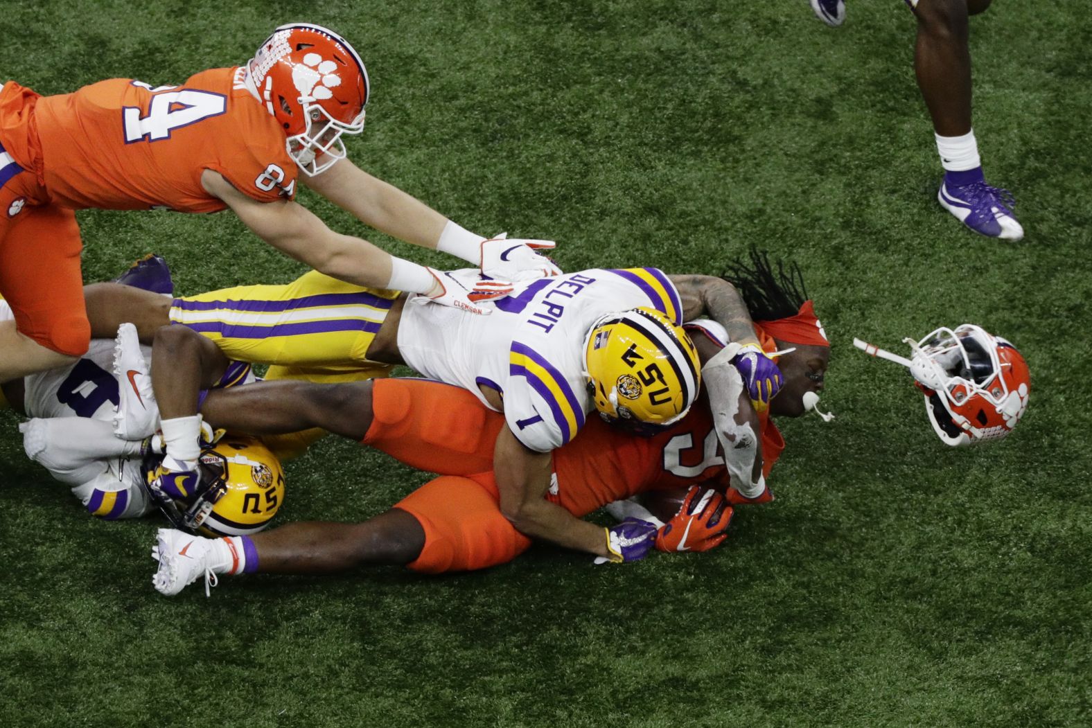 Delpit knocks off Etienne's helmet during the first half.