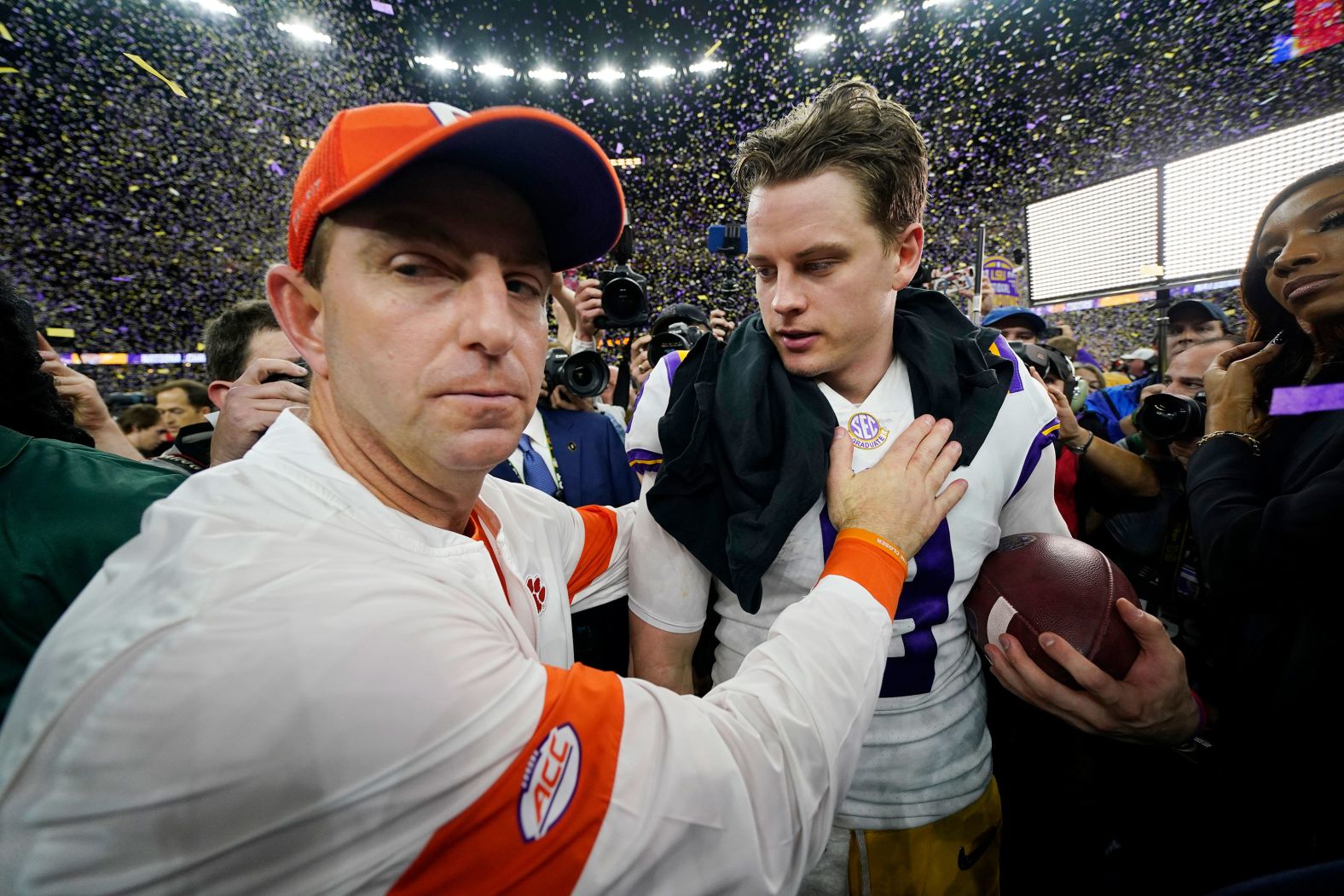Clemson head coach Dabo Swinney congratulates Burrow after the final whistle.