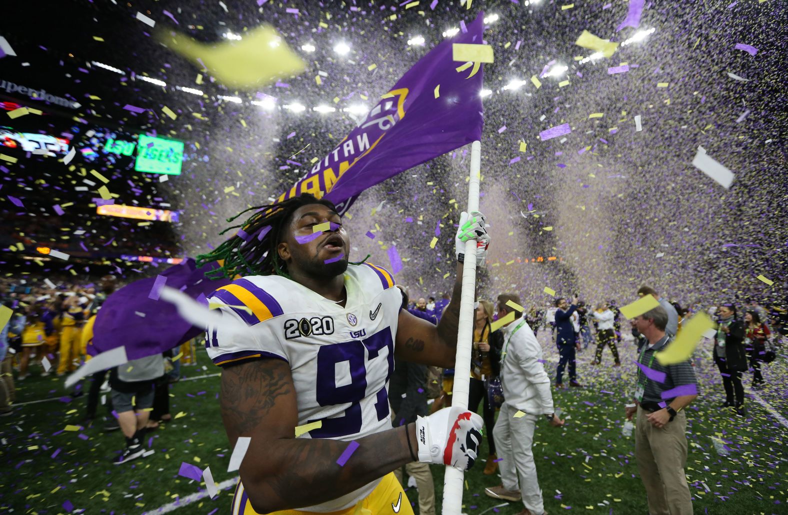 LSU defensive end Glen Logan celebrates as confetti falls in the Superdome.