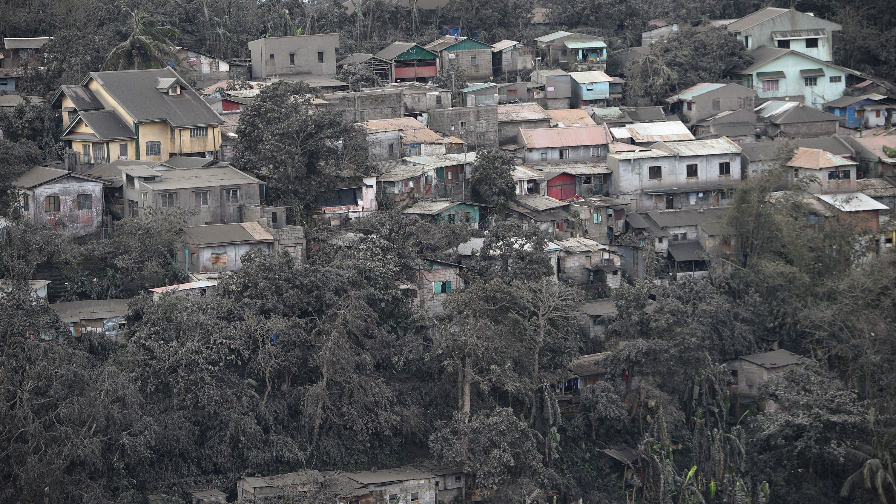 Ash coats the roofs of homes in Tagaytay on January 14. 