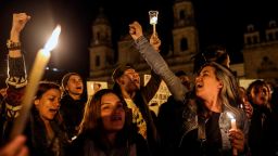 Colombians hold candles as they protest against the assasination of social leaders at the Bolivar square in Bogota on July 6, 2018. - The UN urged the Colombian government Thursday to reinforce security measures of activists a day after the local Ombudsman's Office reported that 311 social leaders and human rights activists were murdered between January 1, 2016 and June 30, 2018. (Photo by Joaquin SARMIENTO / AFP)        (Photo credit should read JOAQUIN SARMIENTO/AFP via Getty Images)