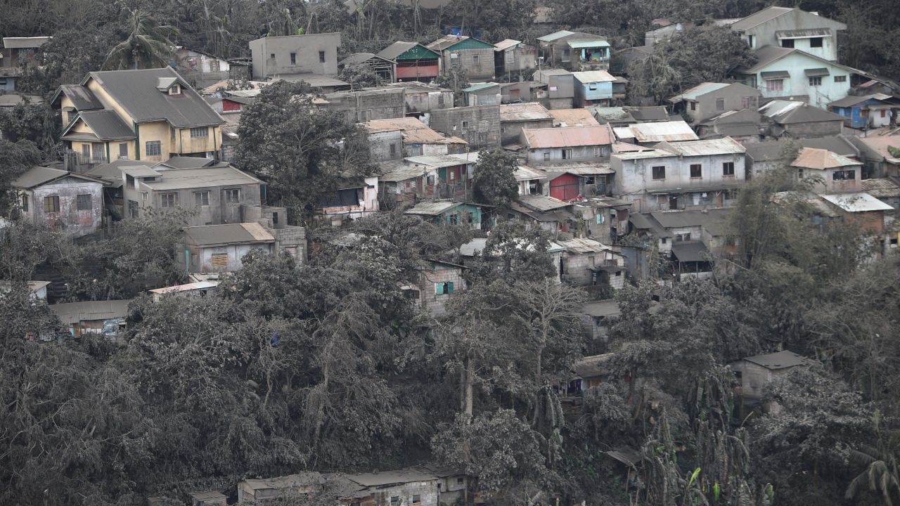 Houses with roofs covered with ash, spewed by Taal volcano in Tagaytay city, south of Manila on January 14, 2020.