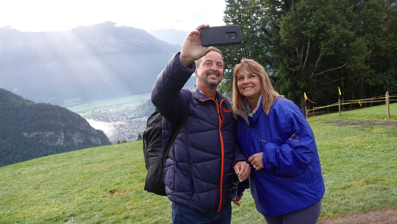 <strong>Hair-raising experience</strong>: Gursky, pictured left, and his wife Gail were vacationing in Switzerland in 2018 when Gursky had a hair-raising hang gliding experience -- the instructor forgot to attach his harness.