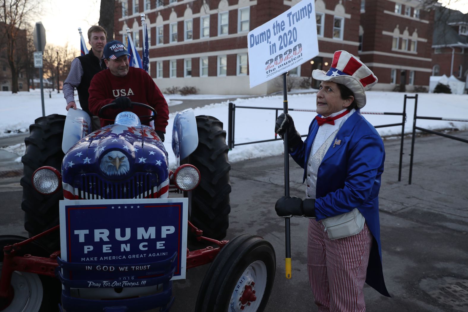 Anti-Trump protester Carol Dunitz faces pro-Trump supporters Gary Leffler, center, and Nathan Montgomery on Tuesday.