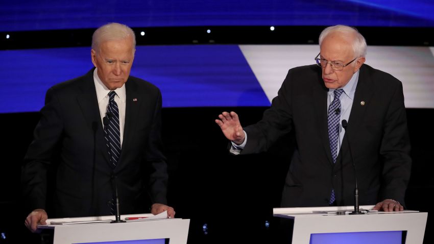 Joe Biden and Bernie Sanders participate in the Democratic debate in Des Moines, Iowa, on January 14.