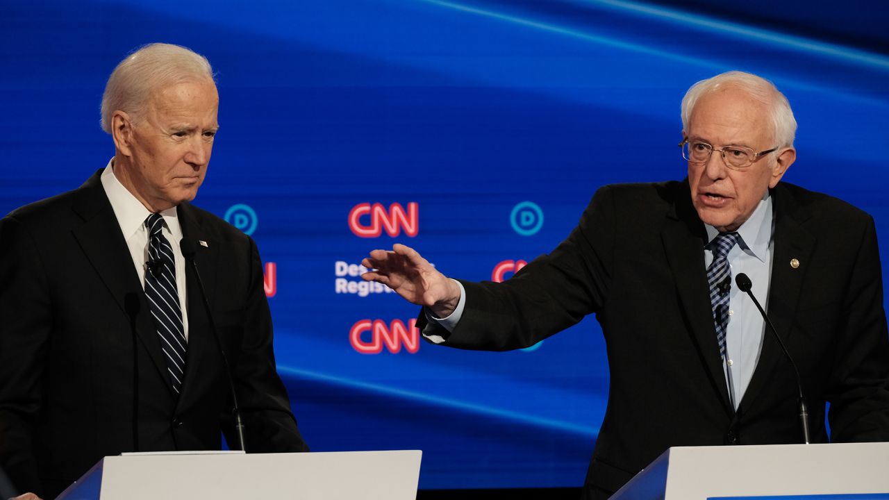 Democratic presidential candidates Joe Biden (left) and Bernie Sanders participate in the CNN/Des Moines Register Democratic debate in Des Moines, Iowa, on Tuesday, January 14.