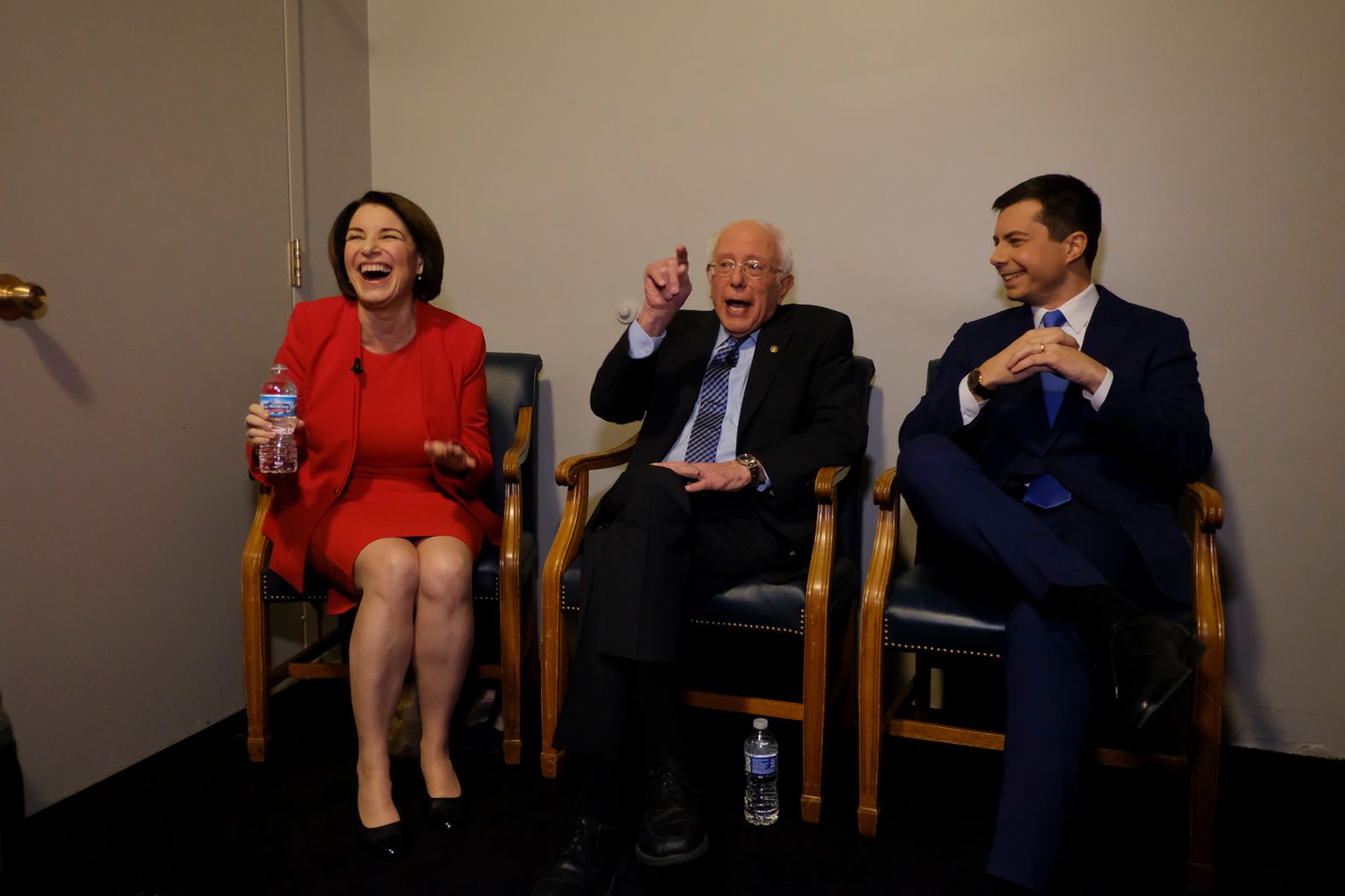 Klobuchar, Sanders and Buttigieg talk backstage before the debate.