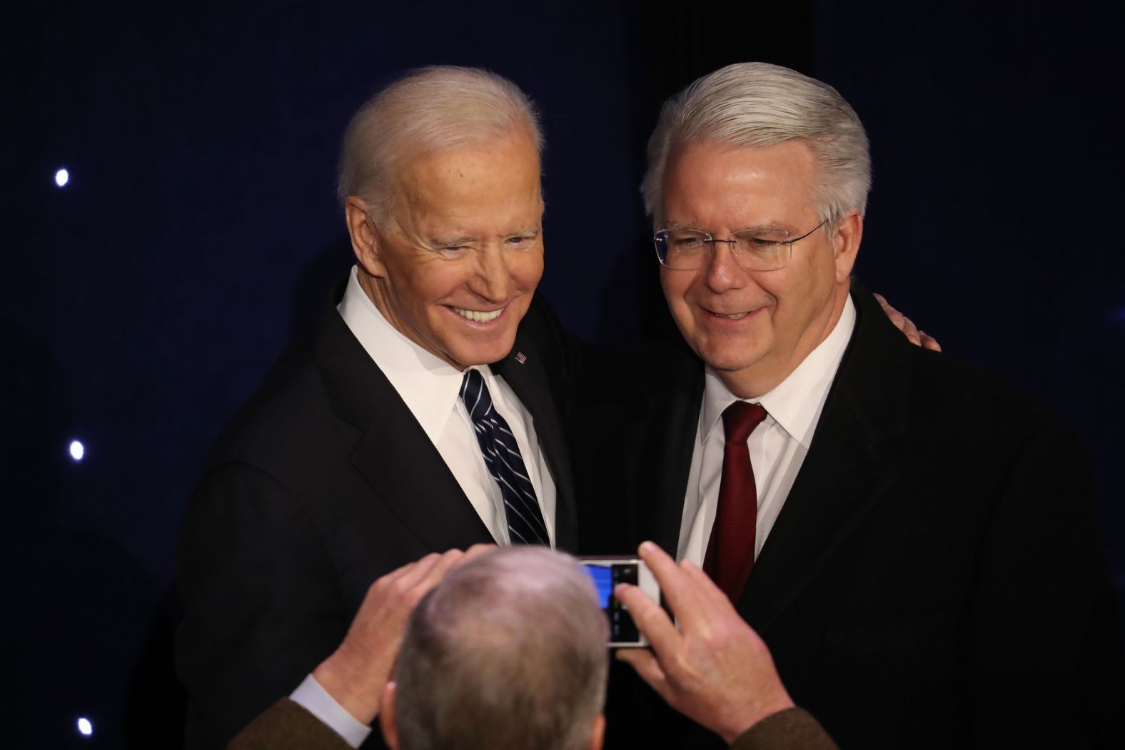 Biden poses for a photo with a supporter after the debate.