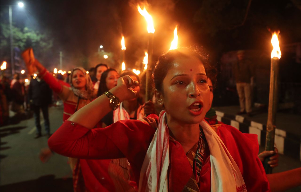 Activists of All Assam Students' Union and other indigenous organizations participate in a torch procession against the Citizenship Amendment Act in Guwahati, India, on Saturday, January 11. 