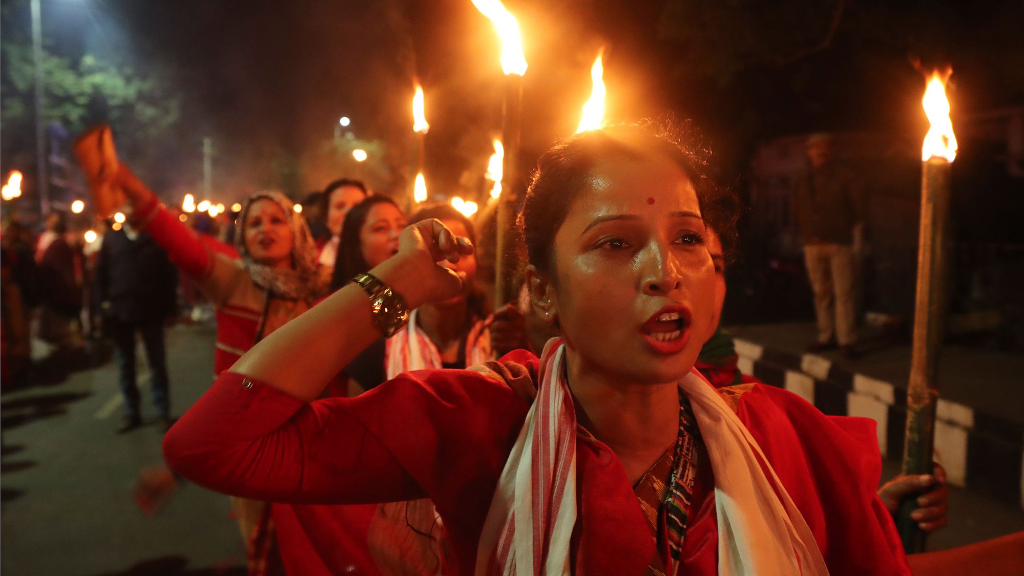 Activists of All Assam Students' Union and other indigenous organizations participate in a torch procession against the Citizenship Amendment Act in Guwahati, India, on Saturday, January 11. 