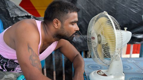 A man tries to cool himself during a heat wave in 2019 in Kolkata, India.