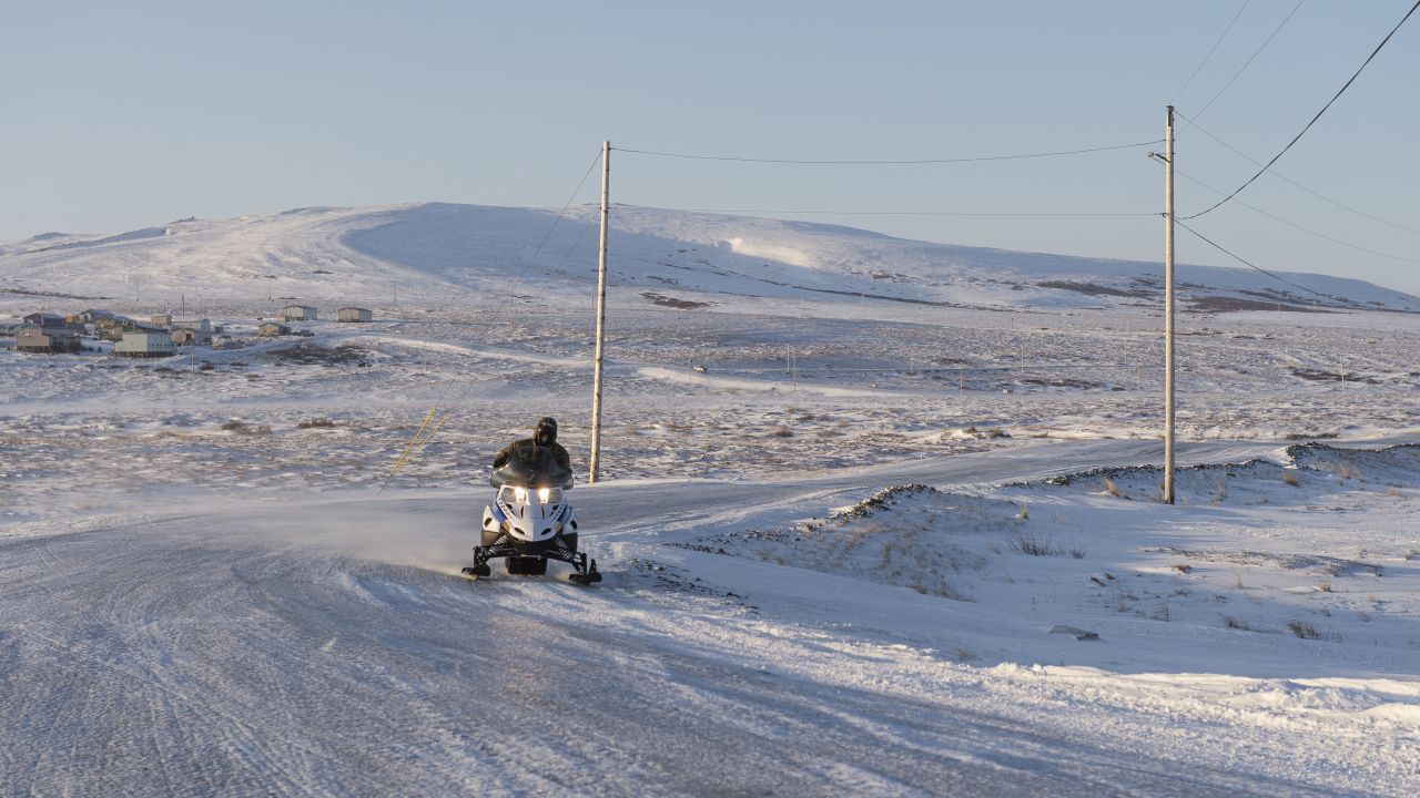 Winter conditions in Toksook Bay make snowmobiles a common form of transportation. 