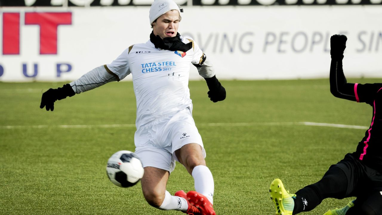 Carlsen is pictured playing football in Velsen-Zuid  prior to a chess tournament in 2017.