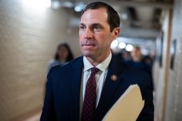 Rep. Jason Crow, leaves a meeting of the House Democratic Caucus in the Capitol in December.