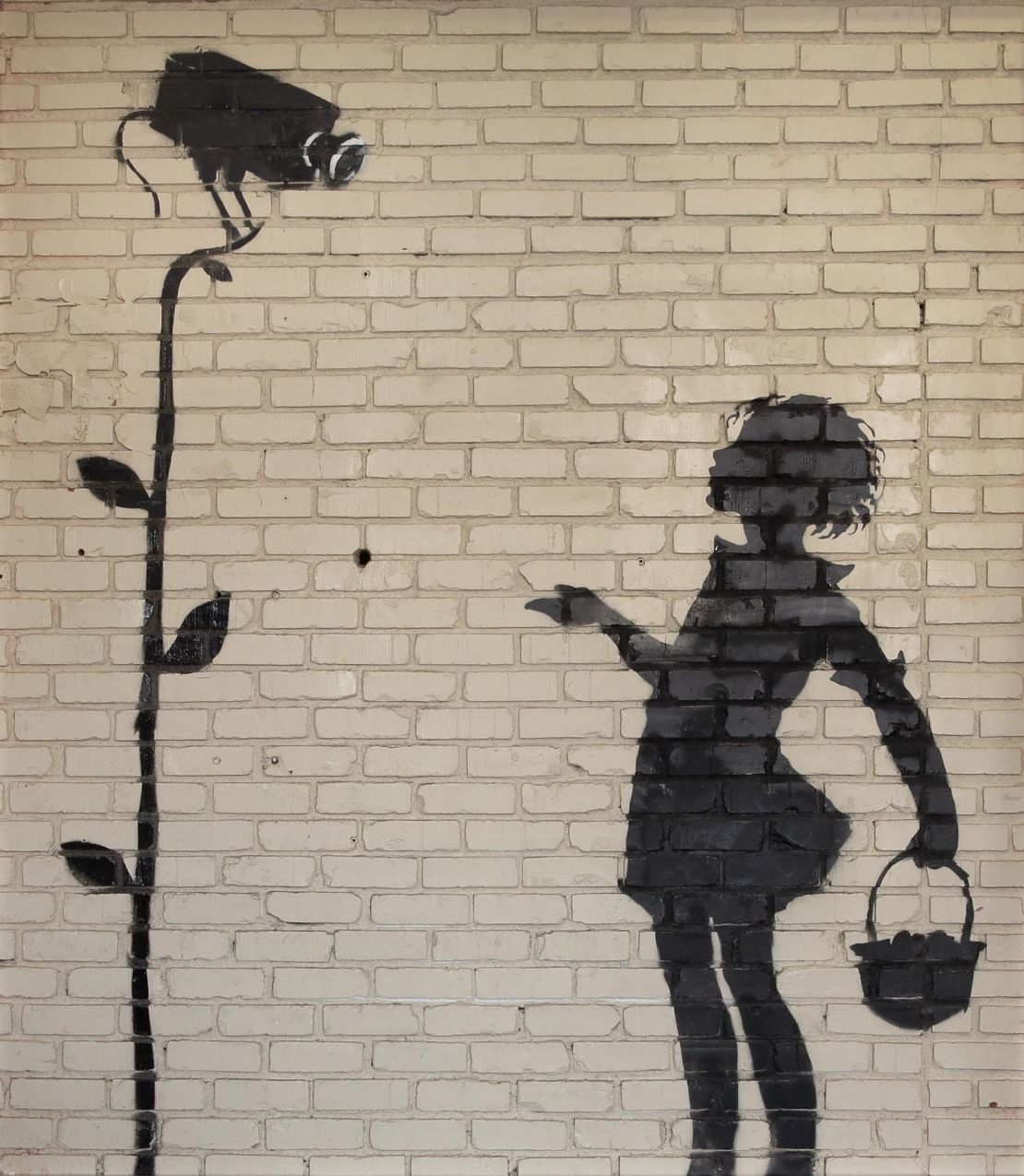 "Flower Girl" (2008) by Banksy.