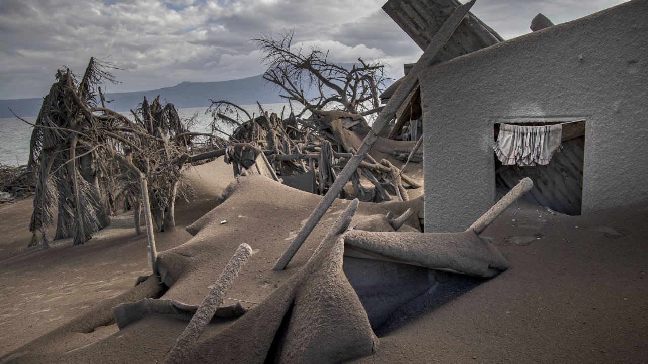Houses near Taal Volcano's crater are seen buried in volcanic ash in Taal Volcano Island.