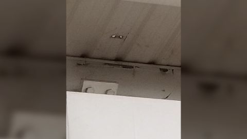 In one cell, water fell through a hole in the ceiling onto inmates' beds, the inspector found.