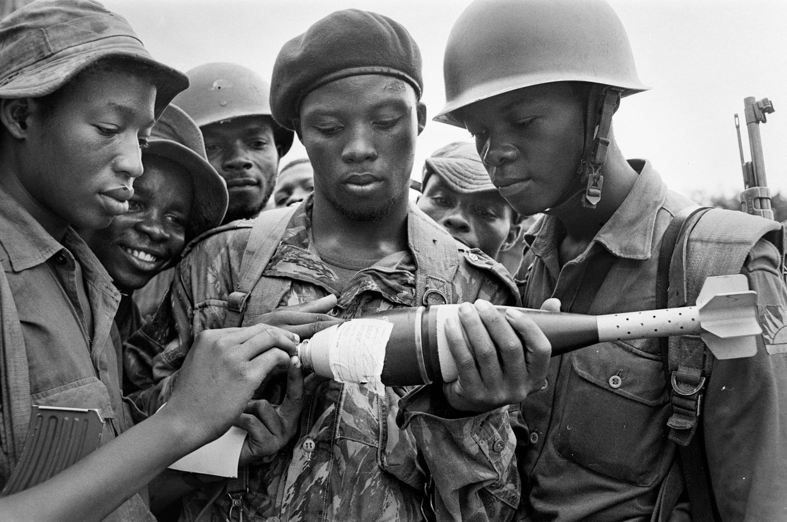 Young Biafran soldiers inspect an unexploded shell in June 1968.