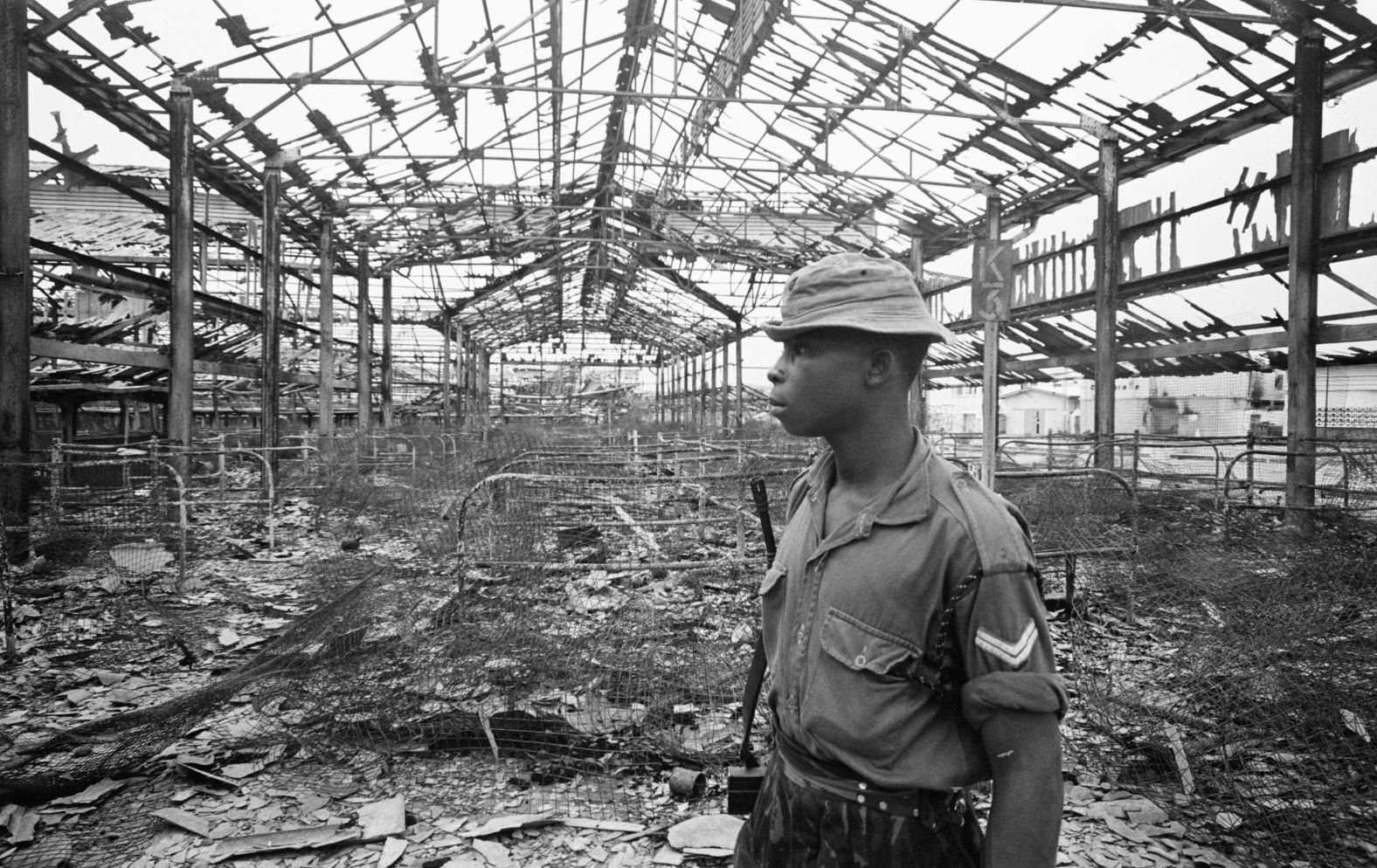 A soldier in the ruins of the Onitsha market after it was gutted during fighting in the city on July 16, 1968.