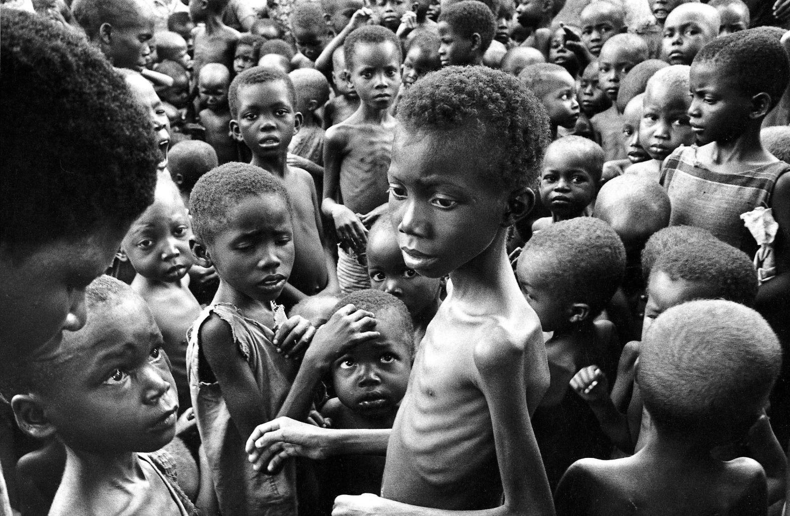 A group of emaciated children photographed in 1970. During the war, the Biafran government reported that Nigeria was using hunger as a weapon to win, and sought aid from the outside world. Nigeria led multiple<a href="https://edition.cnn.com/2020/01/15/africa/biafra-nigeria-civil-war/index.html" target="_blank"> blockades preventing relief materials</a> from getting into Biafra. As a result, thousands of people starved. <br />