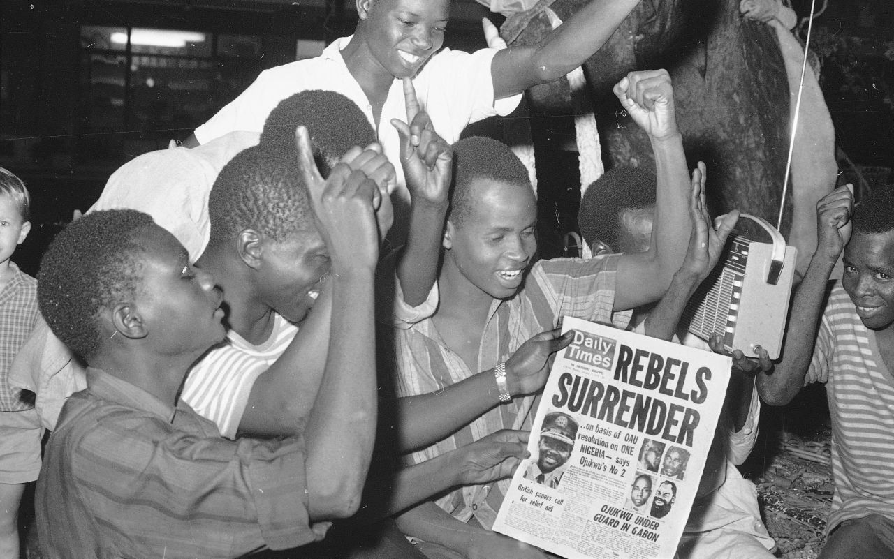 Nigerians in the capital city of Lagos cheer the surrender of the Biafran forces on January 12, 1970. Nigerian leader Maj. Gen. Yakubu Gowon accepted the Biafran surrender and asked all Nigerians to greet the former rebels as brothers.