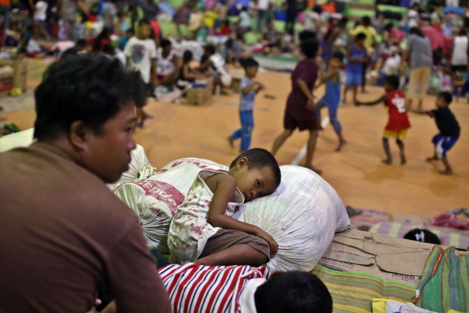 Evacuees rest at an evacuation center in Batangas on Wednesday, January 15.