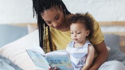 mother reading to toddler